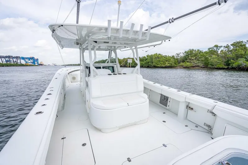  Yacht Photos Pics 2018 Yellowfin 39 Offshore boat on calm water, featuring spacious deck and seating.