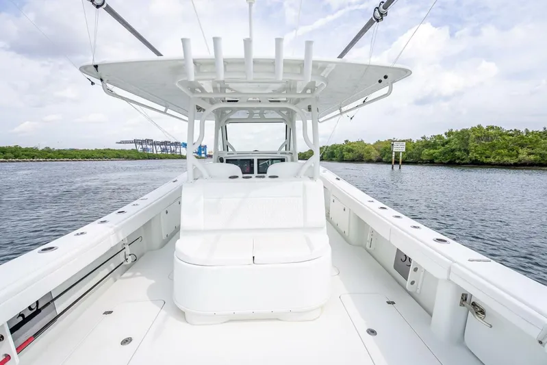  Yacht Photos Pics 2018 Yellowfin 39 Offshore boat on calm water, featuring spacious deck and seating.