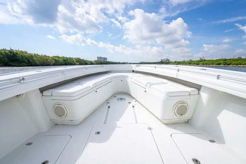  Yacht Photos Pics 2018 Yellowfin 39 Offshore boat interior with seating, under a clear blue sky.