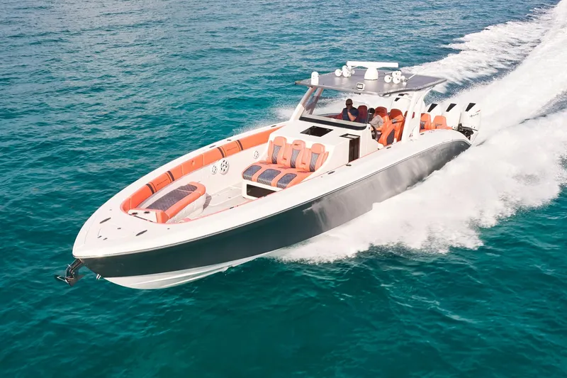  Yacht Photos Pics Midnight Express 43 Open boat cruising on clear blue water, showcasing sleek design and powerful engines.