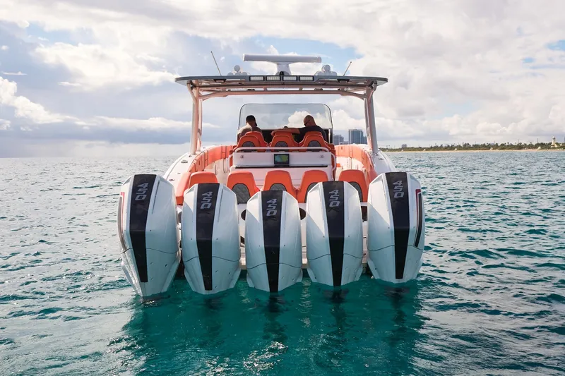  Yacht Photos Pics Midnight Express 43 Open boat with five powerful outboard engines on open water.