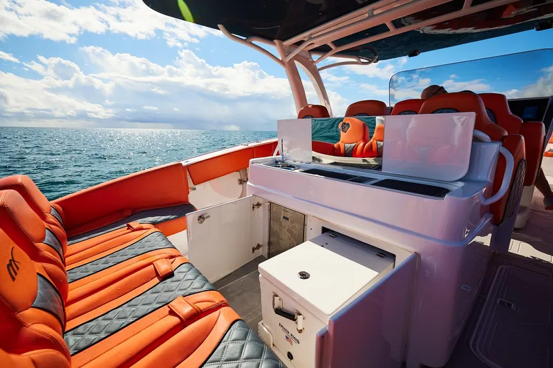  Yacht Photos Pics Luxury Midnight Express 43 Open boat with orange seating on open water.