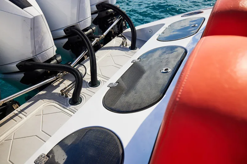  Yacht Photos Pics Midnight Express 43 Open boat deck with dual engines and red seating.