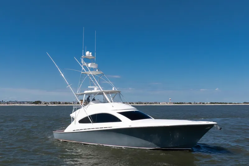 Love Boat Yacht Photos Pics 2015 Ocean Yachts 64 Convertible cruising on open water under clear blue sky.