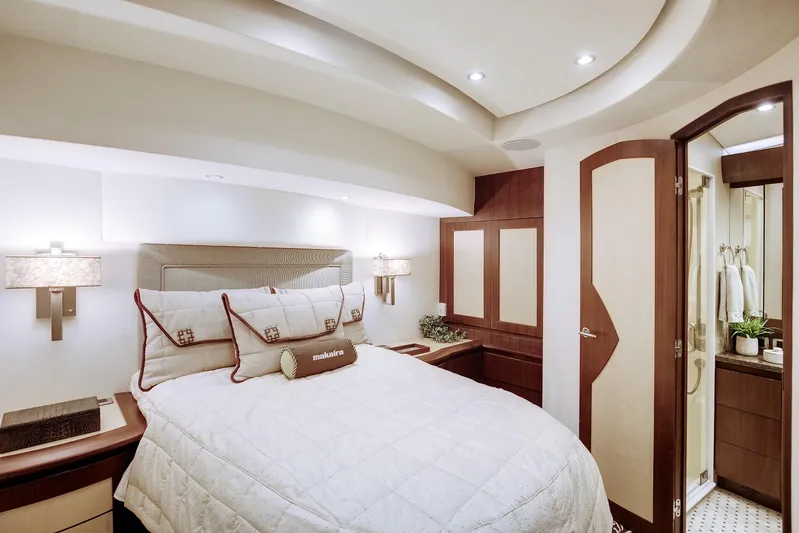 Love Boat Yacht Photos Pics Luxurious bedroom interior of 2015 Ocean Yachts 64 Convertible, featuring elegant design and modern amenities.