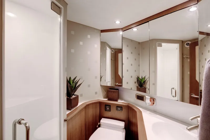 Love Boat Yacht Photos Pics Luxurious bathroom interior of 2015 Ocean Yachts 64 Convertible, featuring modern design and amenities.