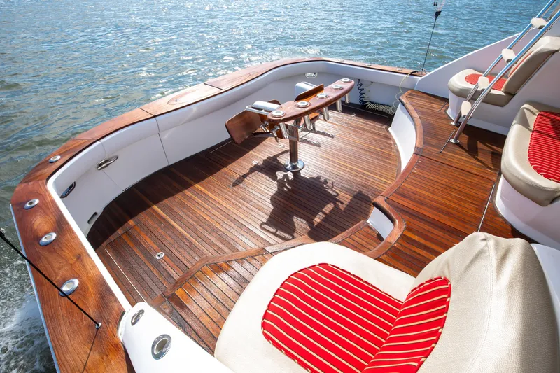 Love Boat Yacht Photos Pics Luxurious 2015 Ocean Yachts 64 Convertible deck with wooden finish and seating.