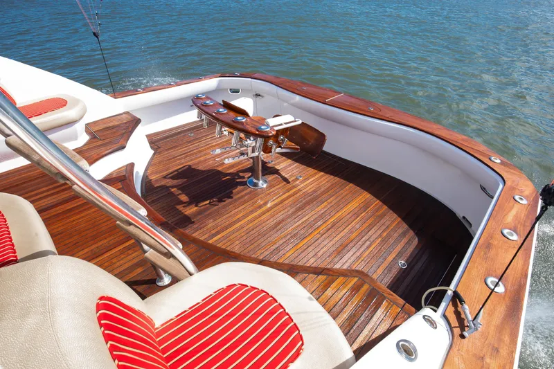 Love Boat Yacht Photos Pics Luxurious 2015 Ocean Yachts 64 Convertible with elegant teak deck and comfortable seating.