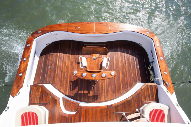 Love Boat Yacht Photos Pics Luxurious 2015 Ocean Yachts 64 Convertible with elegant wooden deck and fishing chair.