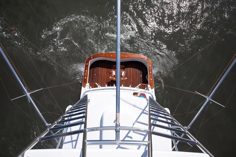 Love Boat Yacht Photos Pics Aerial view of 2015 Ocean Yachts 64 Convertible, showcasing deck and ocean surroundings.