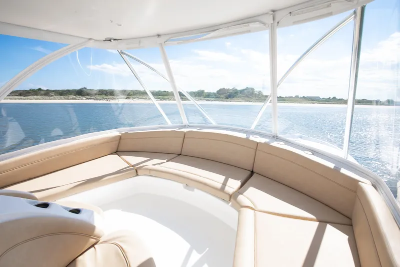Love Boat Yacht Photos Pics Luxurious interior of 2015 Ocean Yachts 64 Convertible with panoramic ocean view.