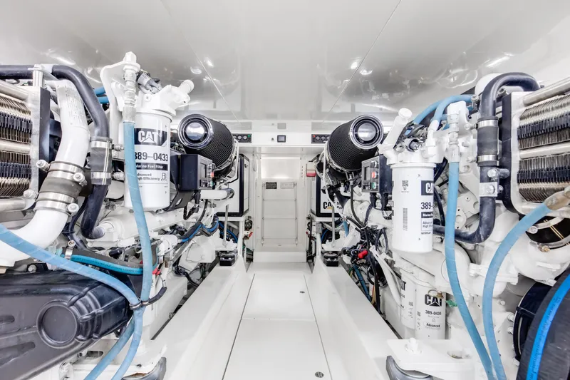 Love Boat Yacht Photos Pics Engine room of 2015 Ocean Yachts 64 Convertible, featuring advanced marine machinery.