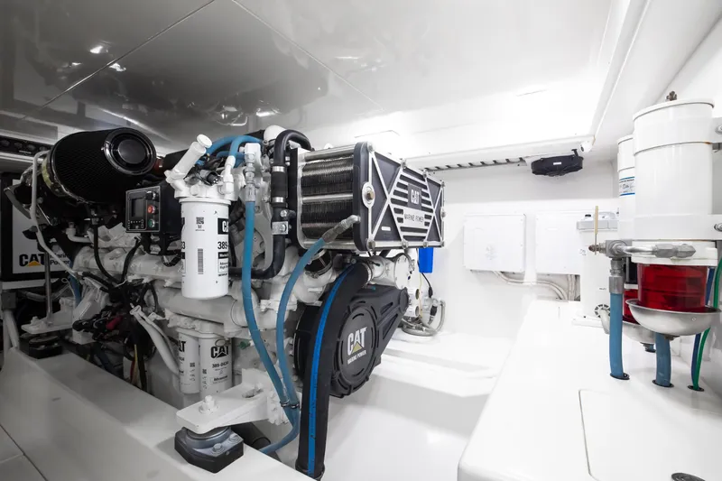 Love Boat Yacht Photos Pics Engine room of 2015 Ocean Yachts 64 Convertible, featuring CAT marine engine components.