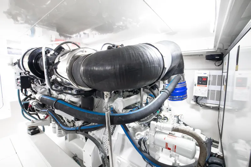 Love Boat Yacht Photos Pics Engine room of 2015 Ocean Yachts 64 Convertible, showcasing advanced marine machinery.