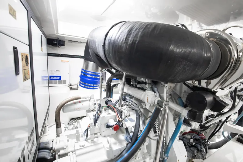 Love Boat Yacht Photos Pics Engine room of 2015 Ocean Yachts 64 Convertible, showcasing advanced marine machinery.