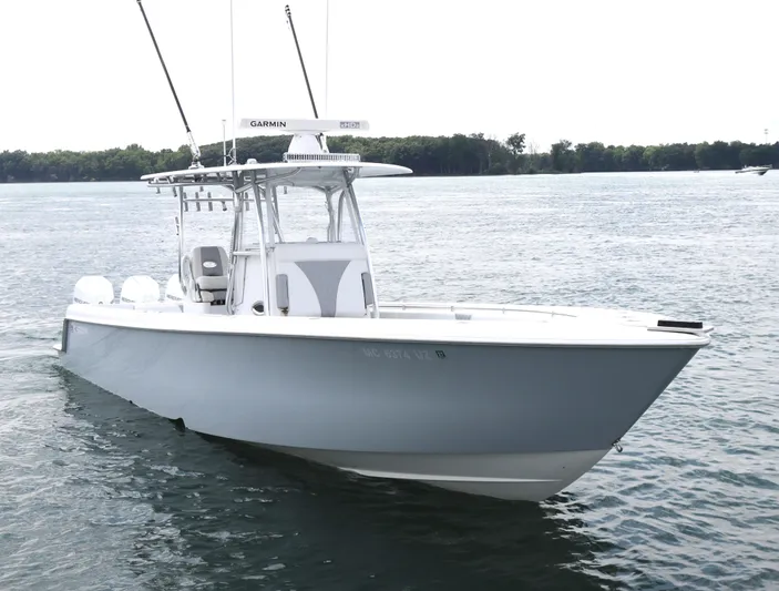  Yacht Photos Pics 2022 Contender 35 ST boat on calm water, featuring sleek design and advanced equipment.