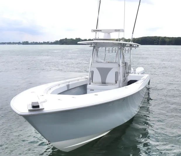  Yacht Photos Pics 2022 Contender 35 ST boat on calm water, featuring sleek design and advanced Garmin technology.