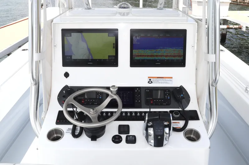 Yacht Photos Pics Center console of 2022 Contender 35 ST boat with navigation screens and controls.