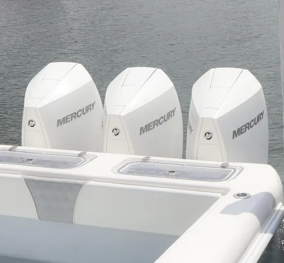  Yacht Photos Pics 2022 Contender 35 ST boat with triple Mercury outboard engines on water.