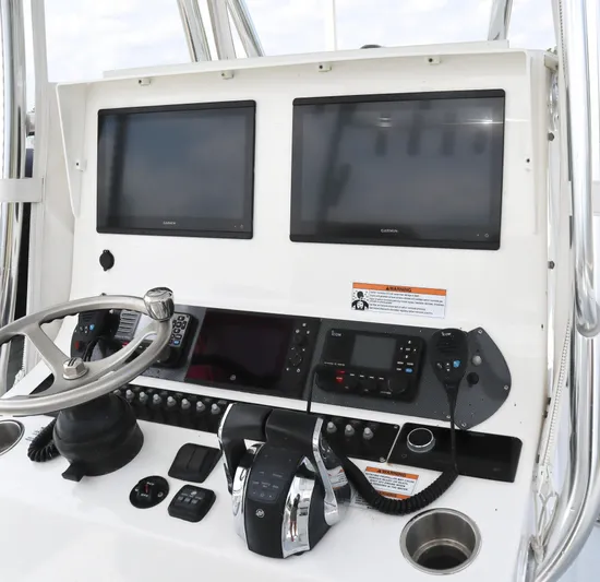  Yacht Photos Pics 2022 Contender 35 ST boat dashboard with dual Garmin screens and control panel.