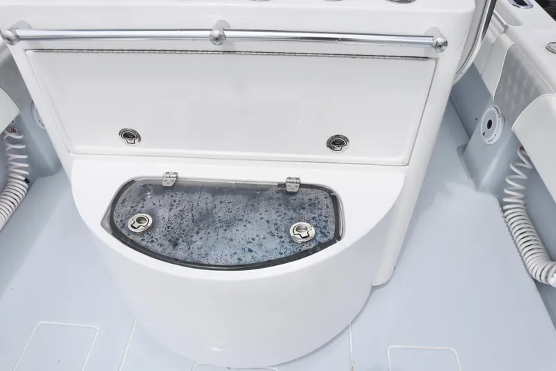  Yacht Photos Pics 2022 Contender 35 ST boat livewell with water, featuring sleek design and stainless steel hardware.