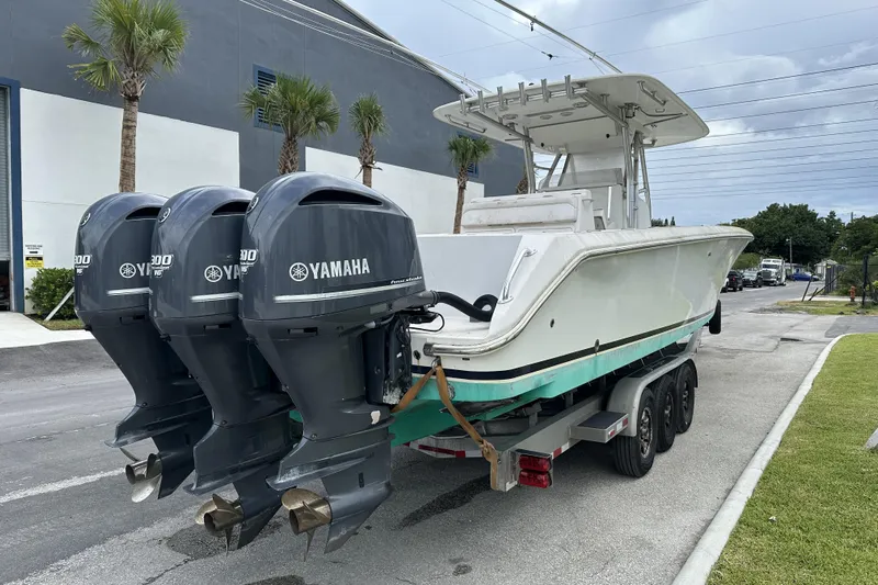  Yacht Photos Pics 2013 Bahama 37CC boat with triple Yamaha outboard engines on a trailer.