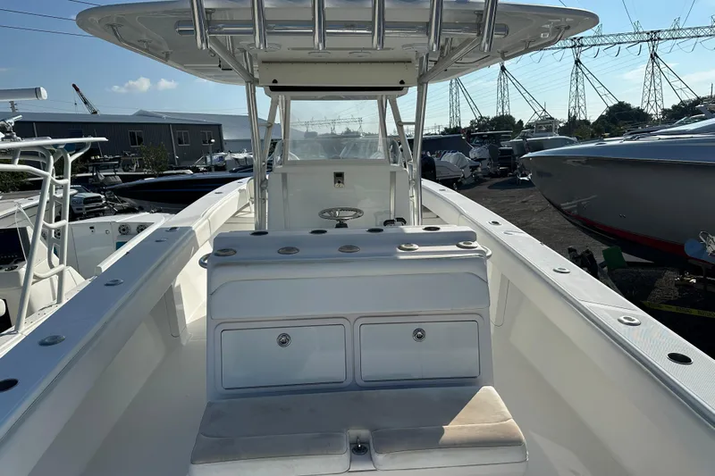  Yacht Photos Pics 2013 Bahama 37CC boat interior with center console and storage compartments.