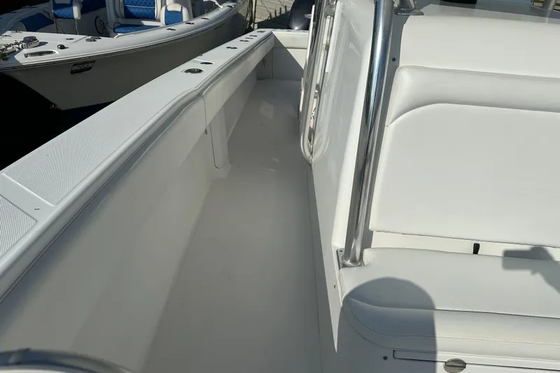  Yacht Photos Pics 2013 Bahama 37CC boat interior with white seating and stainless steel railing.