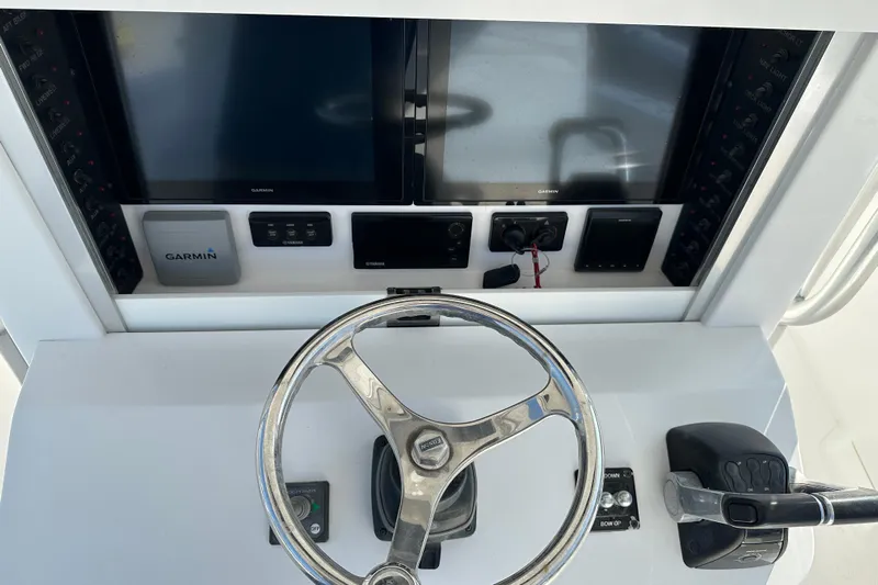  Yacht Photos Pics 2013 Bahama 37CC boat helm with Garmin navigation and control systems.
