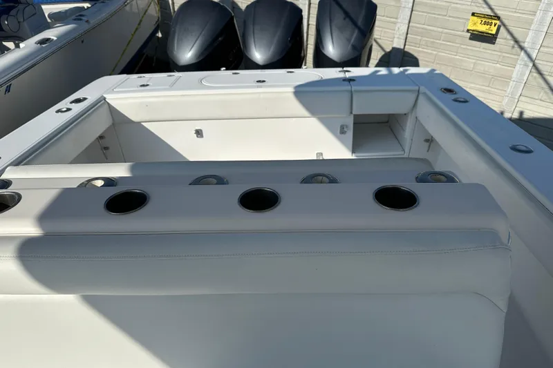  Yacht Photos Pics 2013 Bahama 37CC boat interior with rod holders and storage compartments.
