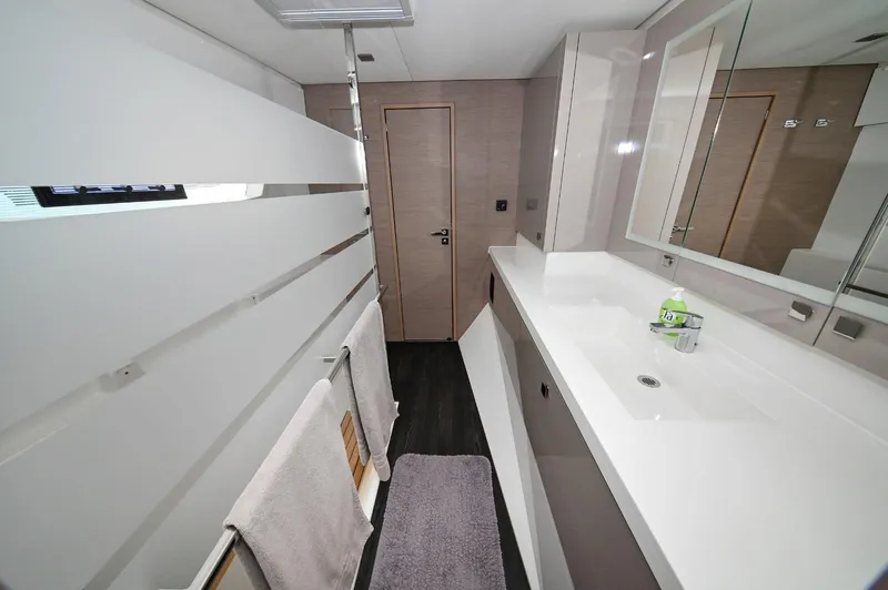 Pandora Yacht Photos Pics Modern bathroom interior of 2019 Fountaine Pajot Saona 47 yacht, featuring sleek design and amenities.