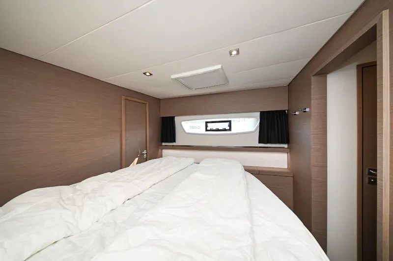 Pandora Yacht Photos Pics Luxurious cabin interior of 2019 Fountaine Pajot Saona 47 catamaran with cozy bedding.
