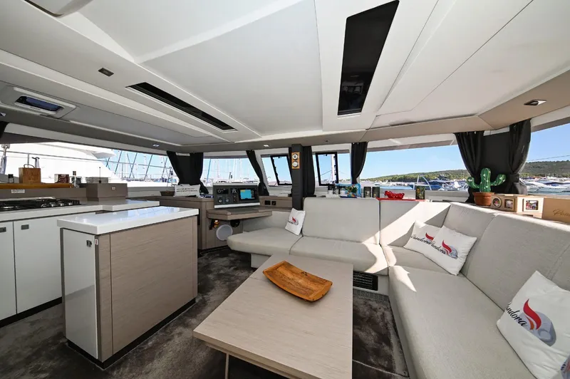 Pandora Yacht Photos Pics Luxurious interior of 2019 Fountaine Pajot Saona 47 catamaran with modern furnishings.