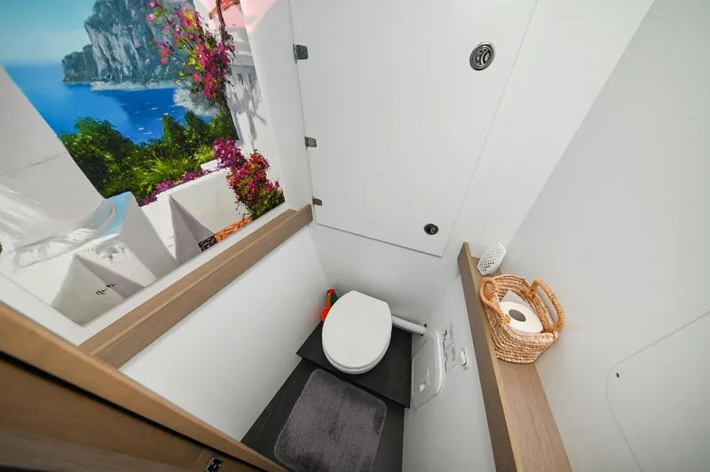 Pandora Yacht Photos Pics Bathroom interior of 2019 Fountaine Pajot Saona 47 yacht with scenic window view.