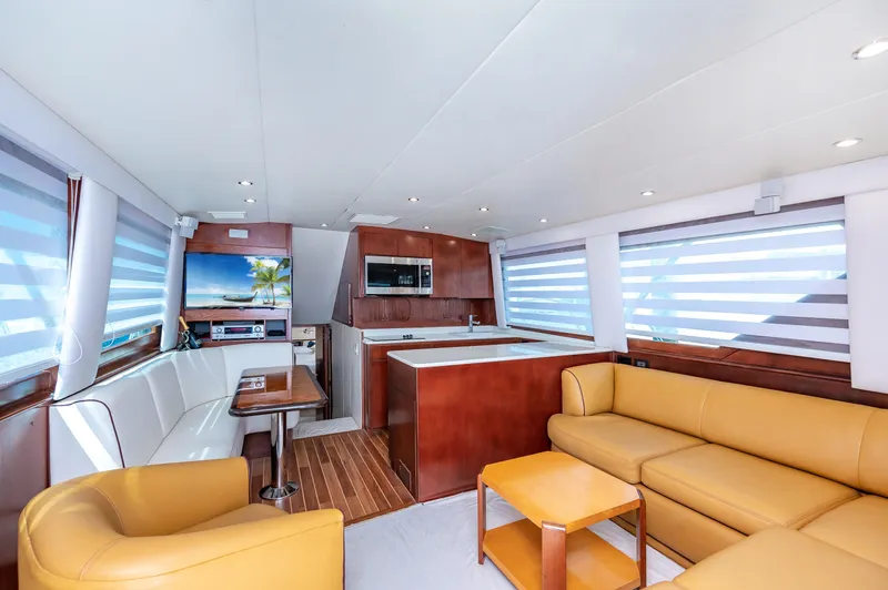 50 Hatteras Convertible Yacht Photos Pics Interior of 1992 Hatteras 50 Convertible yacht with modern furnishings and kitchen.