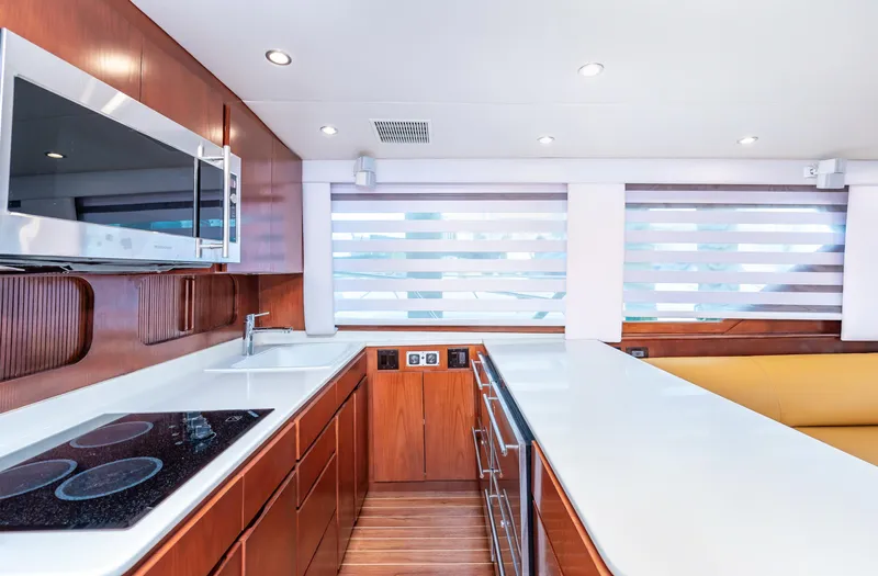 50 Hatteras Convertible Yacht Photos Pics Modern kitchen interior of 1992 Hatteras 50 Convertible yacht with sleek wood cabinetry.