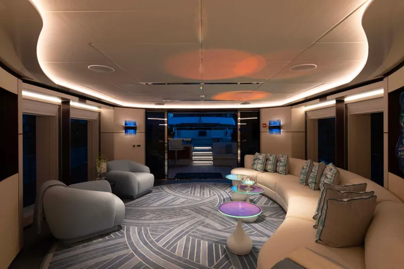 Book Ends Yacht Photos Pics Luxurious interior of 2022 Heesen 5000 yacht with modern seating and ambient lighting.