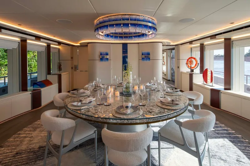 Book Ends Yacht Photos Pics Luxurious dining area on 2022 Heesen 5000 yacht with elegant decor and modern furnishings.