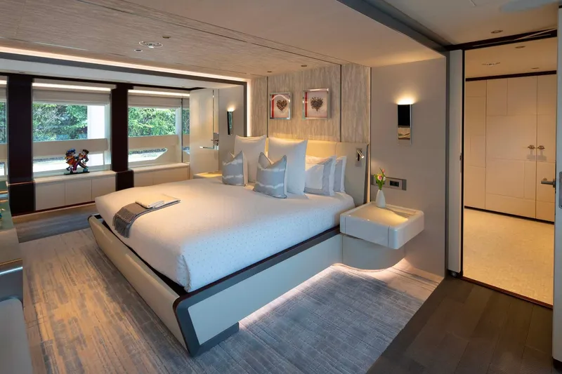 Book Ends Yacht Photos Pics Luxurious bedroom interior on 2022 Heesen 5000 yacht, featuring modern design and elegant decor.