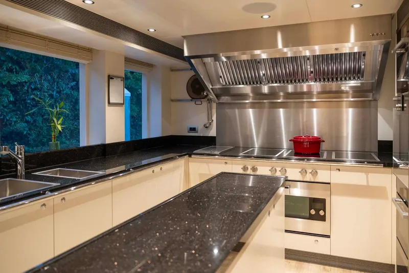 Book Ends Yacht Photos Pics Luxurious kitchen in 2022 Heesen 5000 yacht with modern appliances and sleek design.