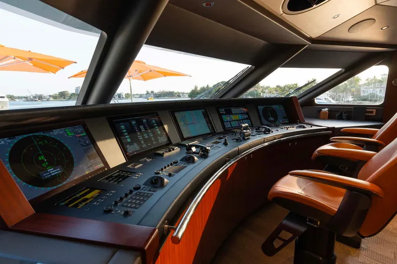 Book Ends Yacht Photos Pics Luxurious Heesen 5000 yacht cockpit with advanced navigation systems, leather seats, and panoramic windows.