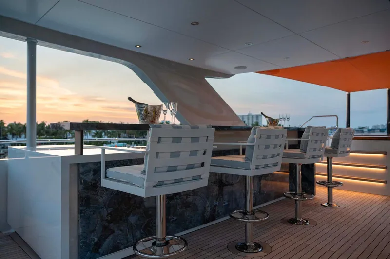 Book Ends Yacht Photos Pics Luxurious Heesen 5000 yacht bar area with sunset view, 2022 model.