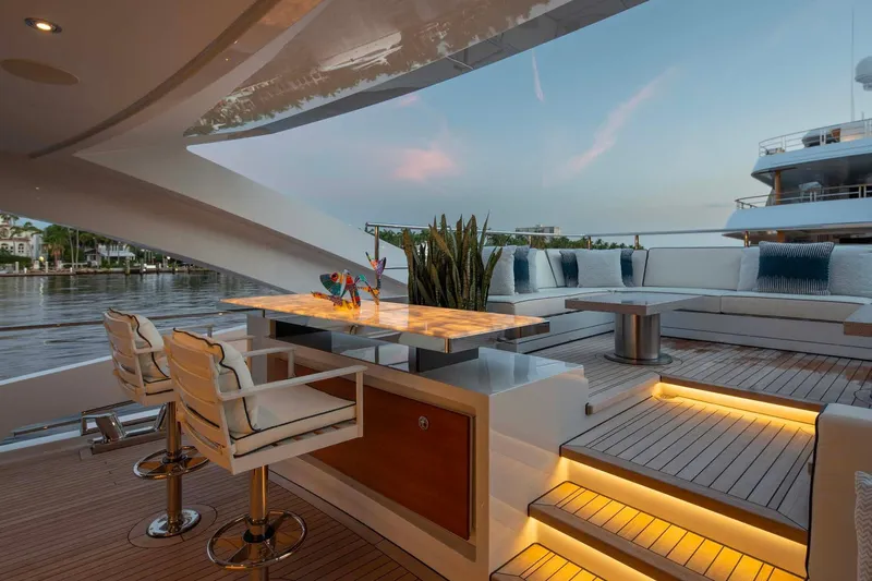 Book Ends Yacht Photos Pics Luxurious Heesen 5000 yacht deck with elegant seating and ambient lighting, 2022 model.