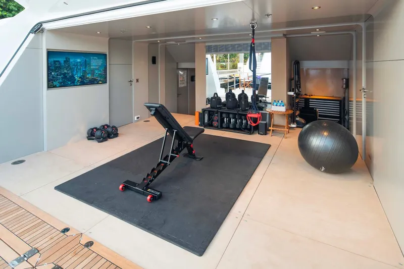 Book Ends Yacht Photos Pics Luxury yacht Heesen 5000 (2022) gym with exercise equipment and modern design.