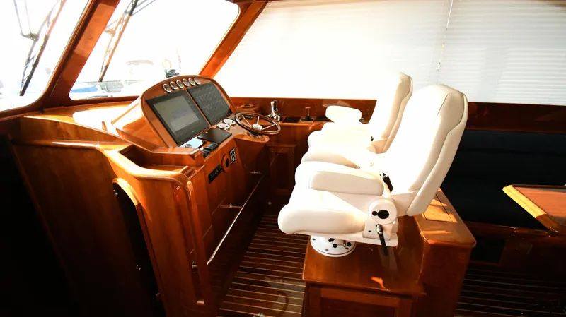 My Lisa Yacht Photos Pics Interior of 2022 Hinckley Talaria 43 yacht with luxurious helm and seating.