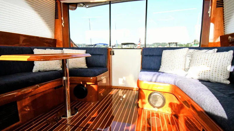 My Lisa Yacht Photos Pics Interior of 2022 Hinckley Talaria 43 yacht with elegant wood finish and plush seating.