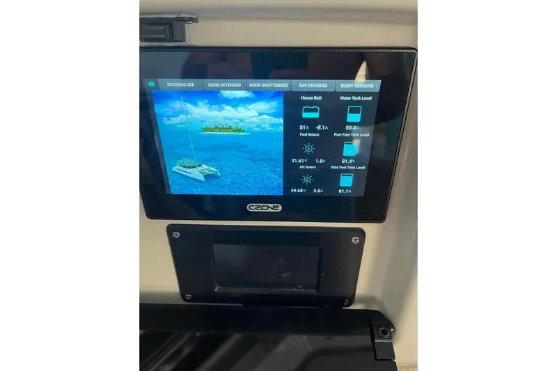 Ruby Rose 2 Yacht Photos Pics Touchscreen control panel on 2023 Seawind 1370 yacht displaying system and fuel levels.