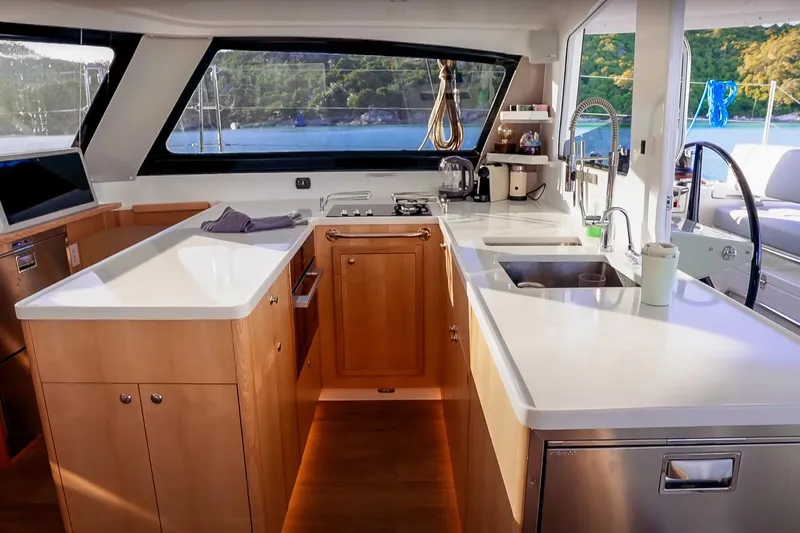 Ruby Rose 2 Yacht Photos Pics Modern kitchen interior of 2023 Seawind 1370 yacht with sleek countertops and appliances.
