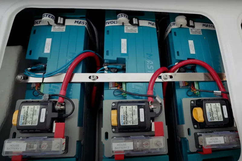 Ruby Rose 2 Yacht Photos Pics Battery compartment of 2023 Seawind 1370 yacht, featuring three blue Mastervolt batteries.