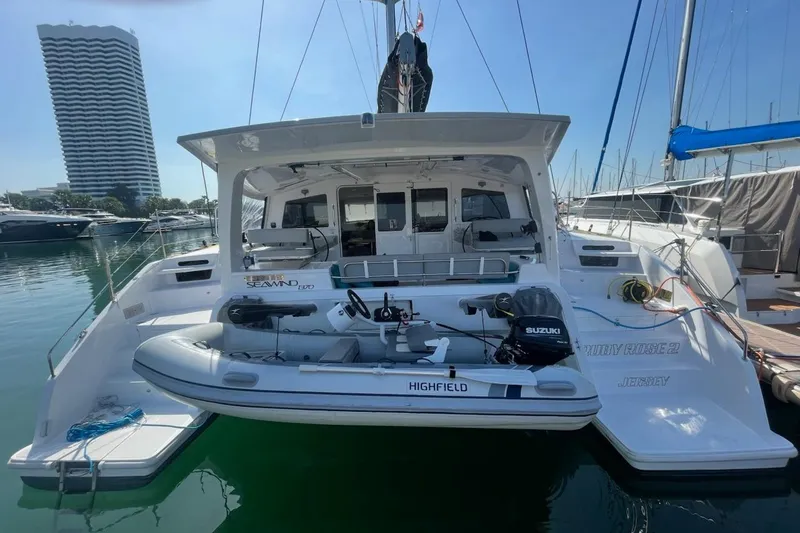 Ruby Rose 2 Yacht Photos Pics 2023 Seawind 1370 catamaran docked with inflatable boat and Suzuki motor.